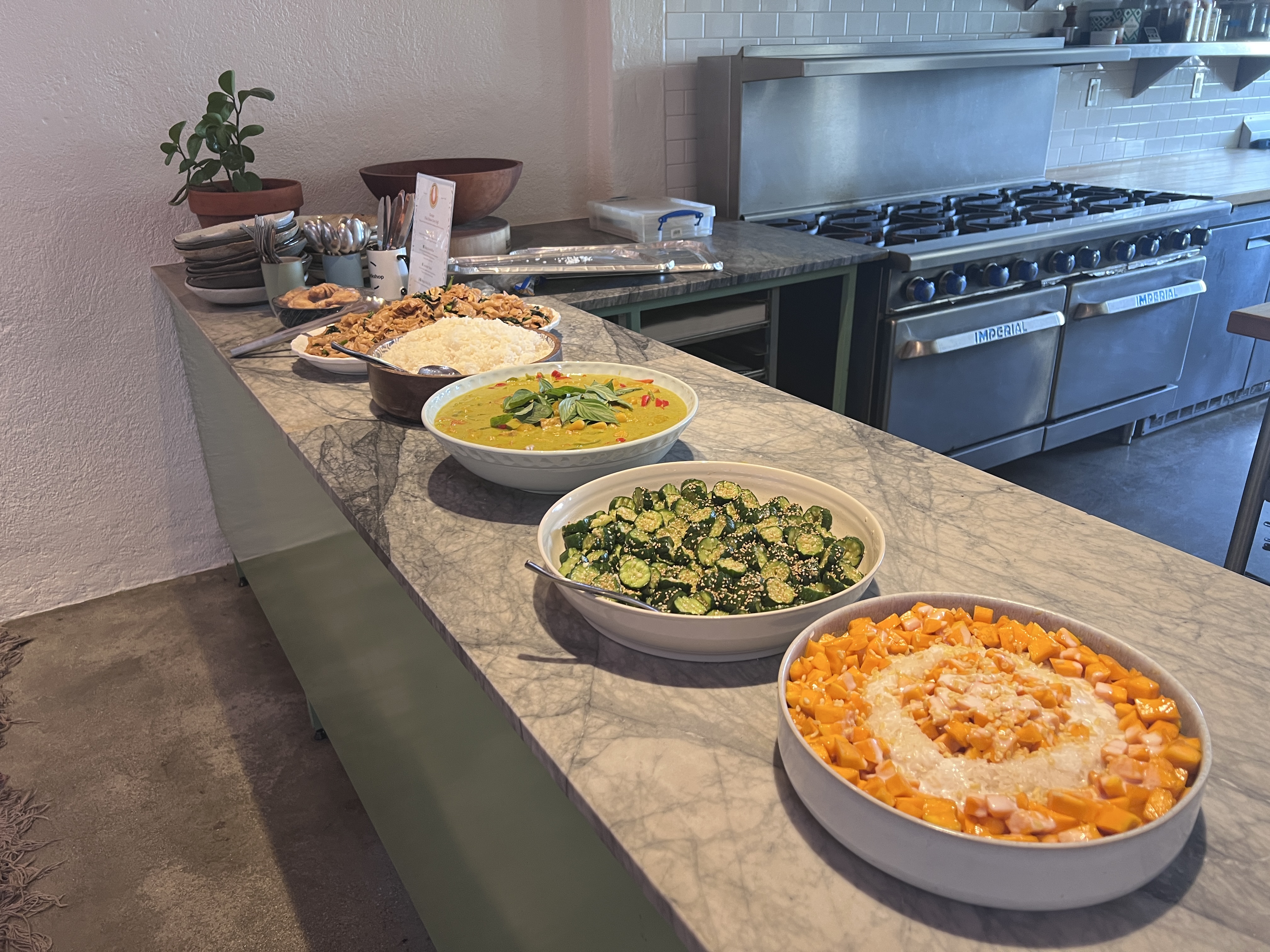 Buffet Style - Multiple bowls of food arranged on counter for family-style dining